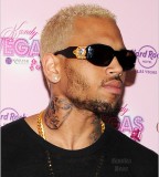 Chris Brown Tattoo Image Of Battered Rihanna On His Neck