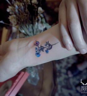 dainty-blue-flower-tattoo