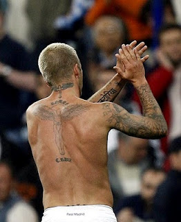 David Beckhams Tattoo On The Back and Right Arm