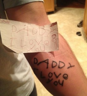 endearing child note on arm man tattoo endearing child note on arm man tattoo