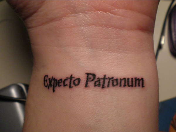 Simple Expecto Patronum Tattoo Design on Wrist Close-Up View