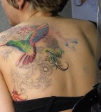 Beautiful Swirly Flowers and Hummingbird Back Tattoo Designs for Women