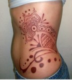 Feminine Traditional Polynesian Hip & Rib-cage Tattoo Design for Women