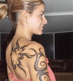 Feminine Tribal Swirls Half-Sleeve to Upper-back Tattoos Designs for Women