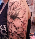 Awesome Tattoo Flower Stars On Shoulder