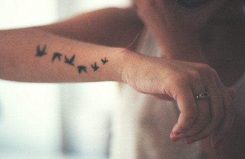 Fantastical Picture Of Flying Bird Silhouette Arm Tattoo Design