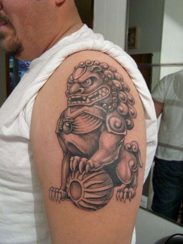 Foo Dog Upper Arm Tattoo Design For Men