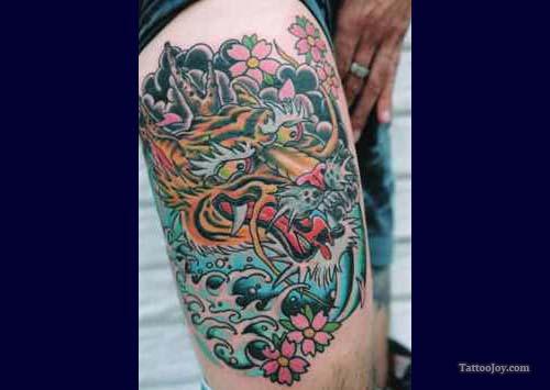 Foo Dog Tattoo On The Thigh