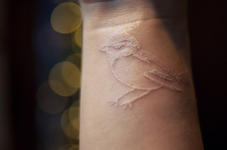 Bird Tattoo in White Ink Tattoo Design