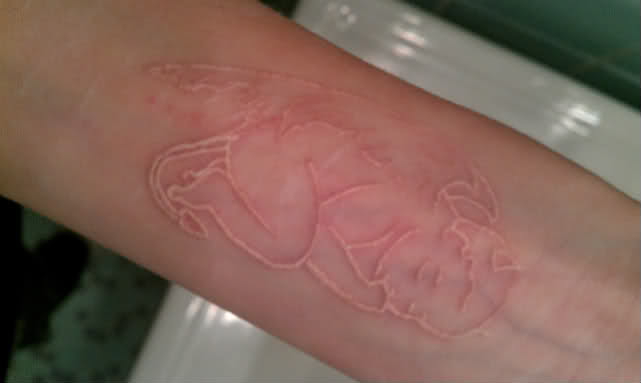 Baby Devil White Ink Tattoo