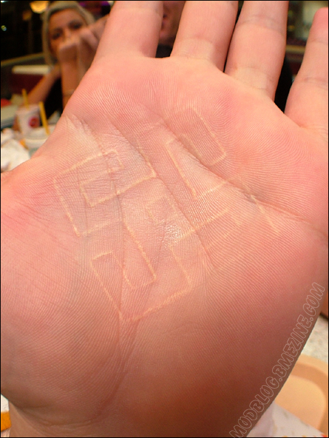 Swastika Symbol White Ink Tattoo on Palm