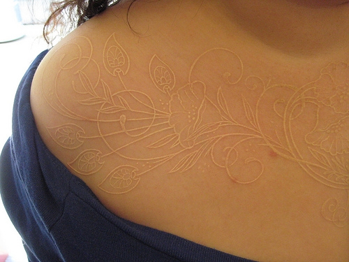 Amazing Flower White Ink Tattoo On Chest