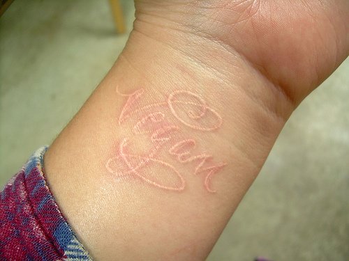 Name On Wirst White Ink Tattoo