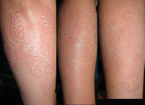 Curly Flower White Tattoo Design on Forearm