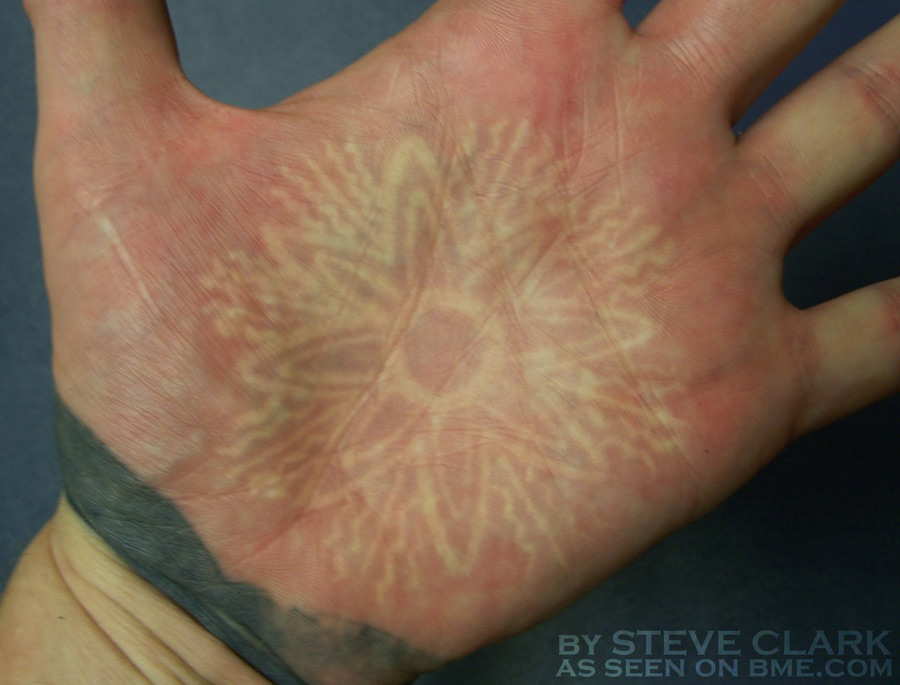 Sun Symbol White Ink Tattoo on Palm
