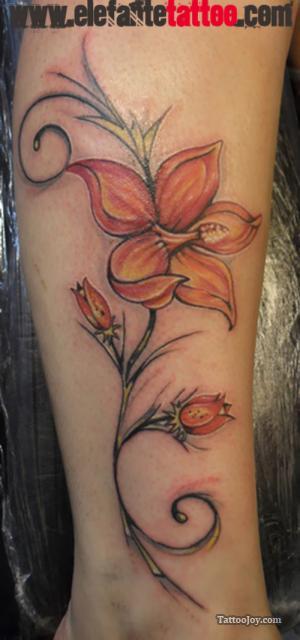 Orange Hibiscus Tattoo On Forearm