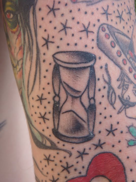 Hourglass and Star Tattoo Design