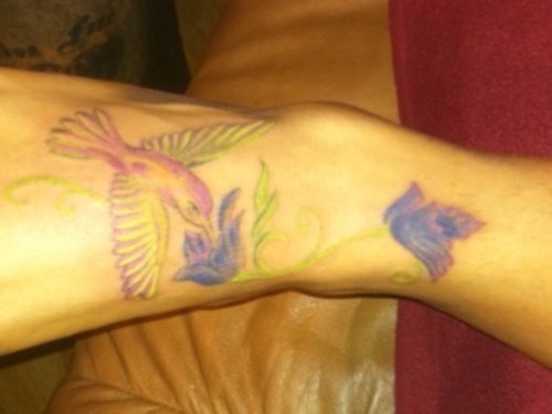 Carries Hummingbird Tattoo Design On Foot