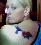 Green Hummingbird And Red Flower Tattoo On Left shoulder.