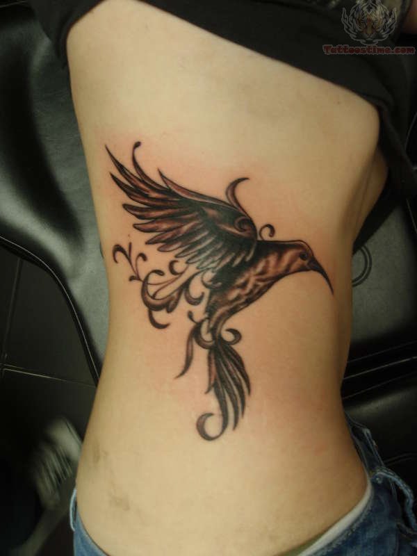 Flying Hummingbird Inked With Swirls On Ribcage