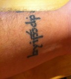 Simple Wrist Tattoo Qoute Design Example