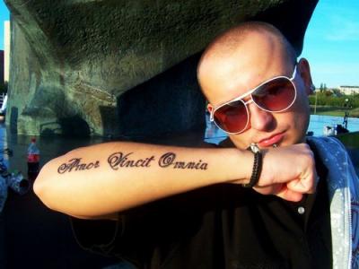 Latin Tattoo On Outside Arm For Man