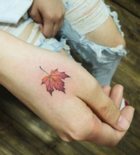 maple-leaf-on-hand-autumn-tattoo maple-leaf-on-hand-autumn-tattoo