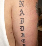 Last Name Arm Tattoo Design