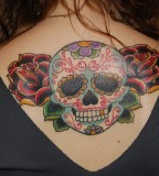 Ethnic Style Old School Skull Tattoo Design On Upper Back