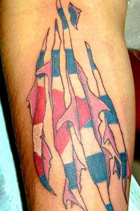 Stunning Art Puerto Rican Flag under Torn Skin Tattoo