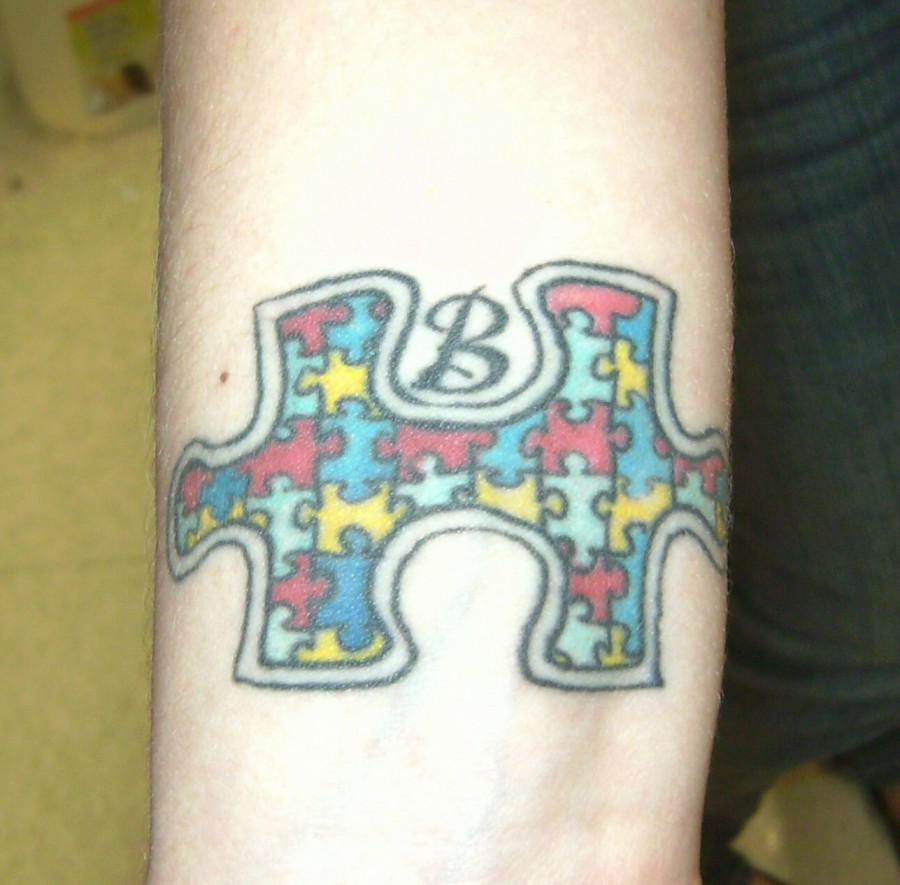 Colorful Puzzle Piece with B Initial Forearm Tattoo