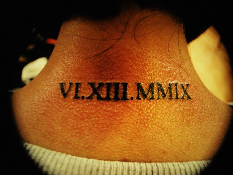 Roman Tattoo Design On Back Neck