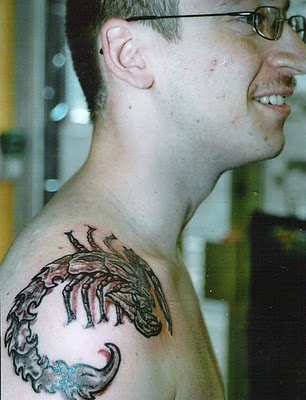 Men Shoulder Scorpion Tattoo with Red Shades