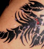 Sparkling Red Eyes Scorpion Tattoo