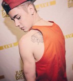 Justin Bieber's Canadian Hockey Teams Logo Tattoo (In Memory of Grandpa)