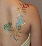 Colorful and Glittery Shoulder Blade Tribal Tattoos for Women