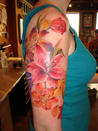 Painful Stargazer Lily Tattoo Design on Arm for Girls