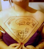 Beautiful Photo Of Superman Chest Tattoo 