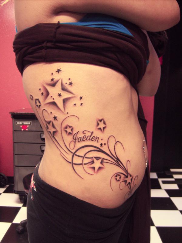 Sensational Girl’s Side Stars and Swirls Tattoo
