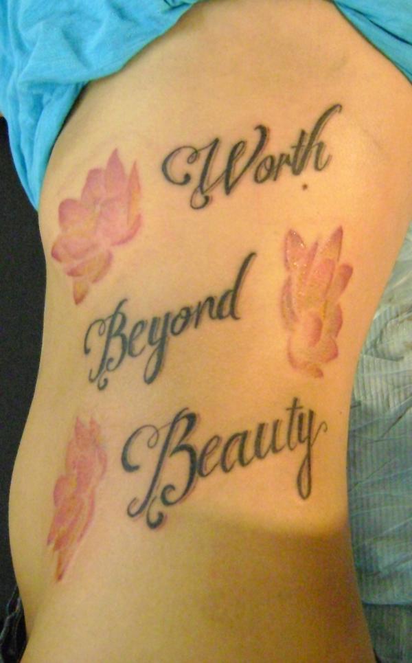 Lettering and Flower Tattoo on Side for Women
