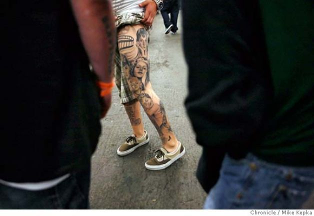 Man with Left Leg Tattoo artist at Ink Slinger Tattoo