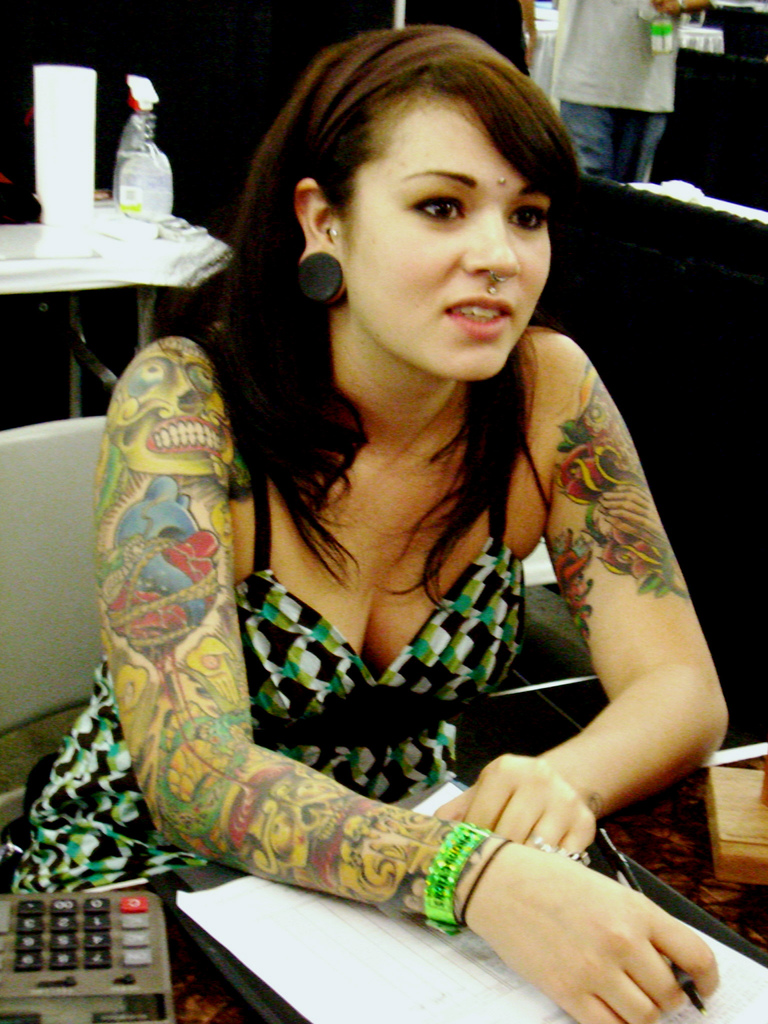 Girl with Painful Tattoo on Arm at Tattoo Expo San Francisco