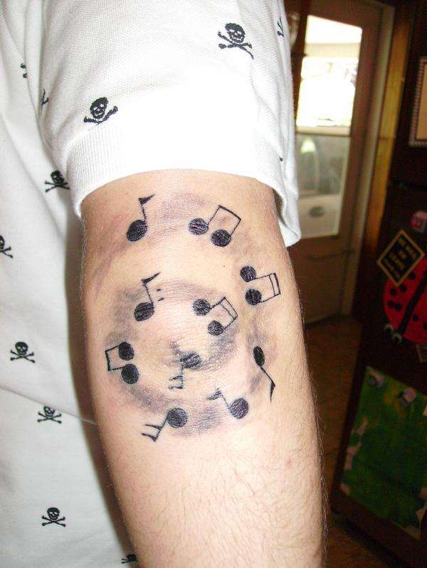 Spinning Musical Note Tattoos