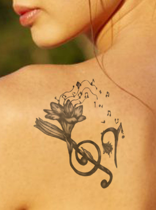 Music Note Tattoos On Woman Shoulder