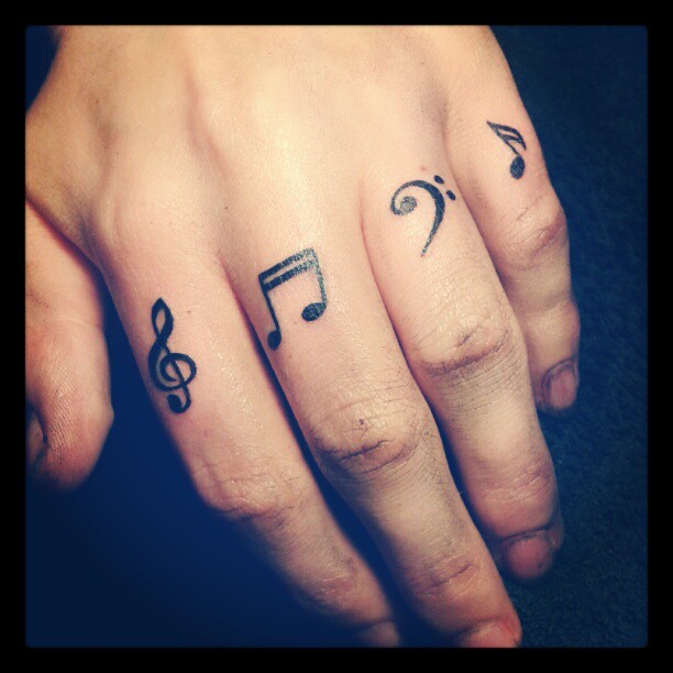 Musical Notes Tattoo On Finger