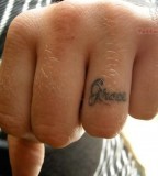 Initial Ring Finger Men Tattoo Design Picture