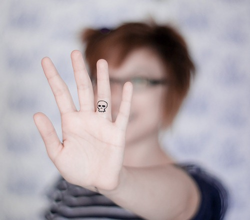 Grand Skull Shaped Tattoo Design on Ring Finger