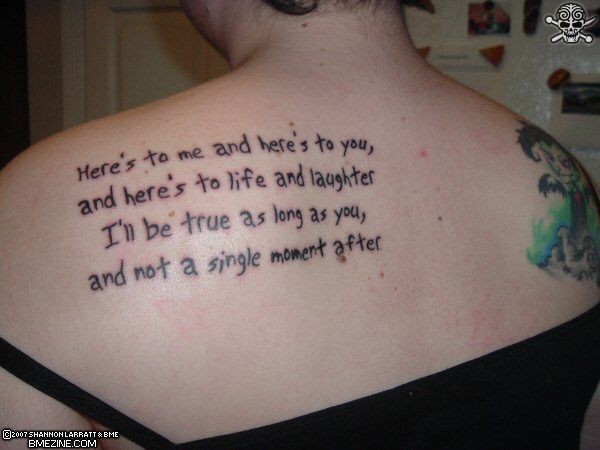 Girl with Vent Tattoo On The Upper Back