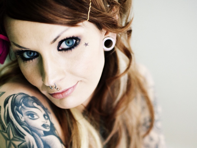 Blonde Girl With Tattoos And Piercings Image