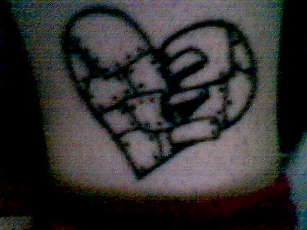 Broken Heart On Inner Ankel Tattoo